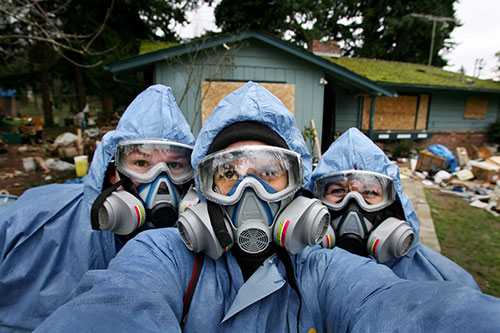 people in decontamination suits in a disaster response in Seattle.